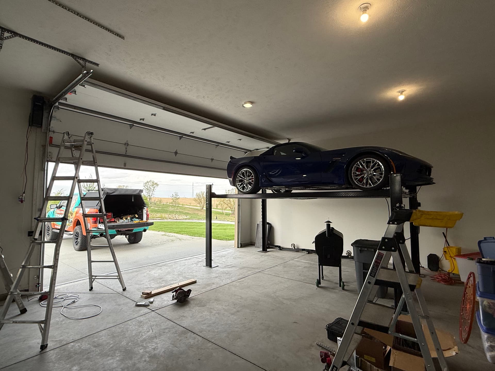 High-Lift Garage Door Conversion That Actually Makes Room for a Car Lift