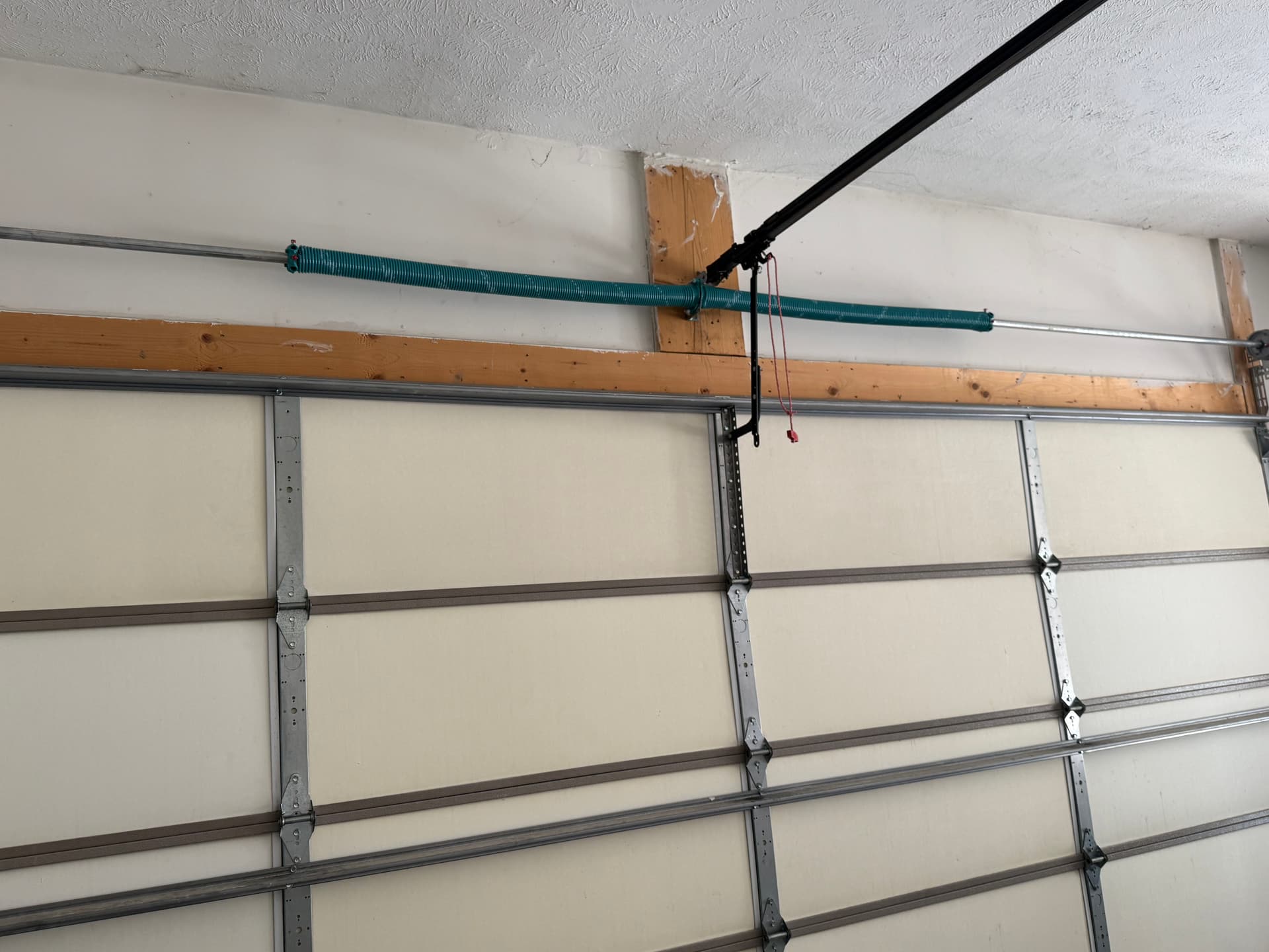 Why We Custom-Cut Torsion Springs On Site