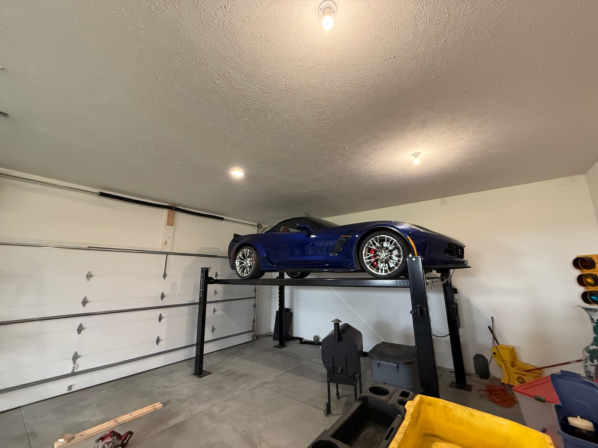 High-Lift Garage Door Conversion That Actually Makes Room for a Car Lift